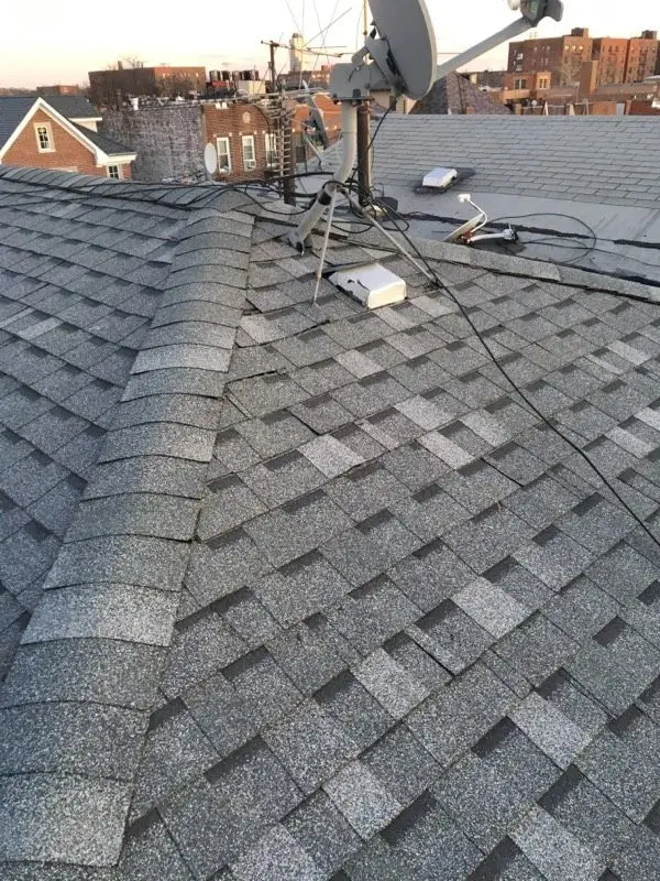 Ridge cap shingles on a newly finished roof